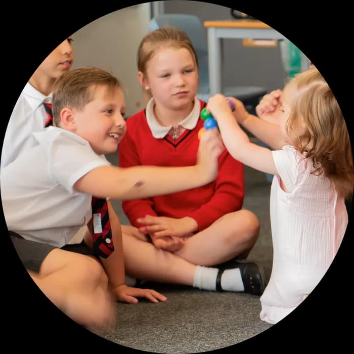School children learning form a young girl